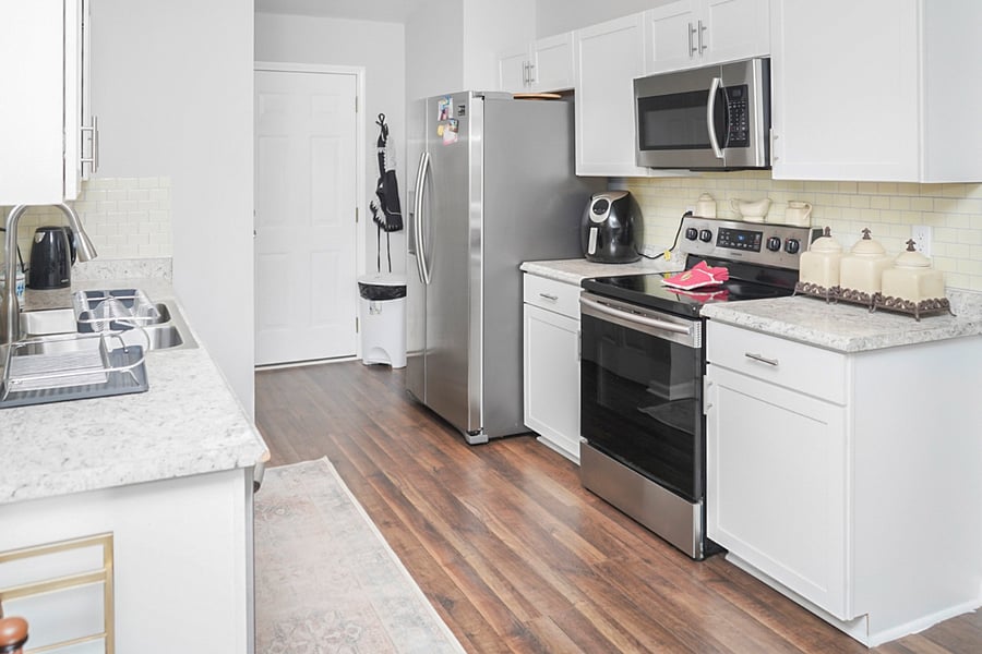 Whip up your favorite meals in this fully equipped kitchen, featuring modern appliances and ample counter space. Whether you're preparing a quick breakfast or a full-course dinner, everything you need is right at your fingertips.