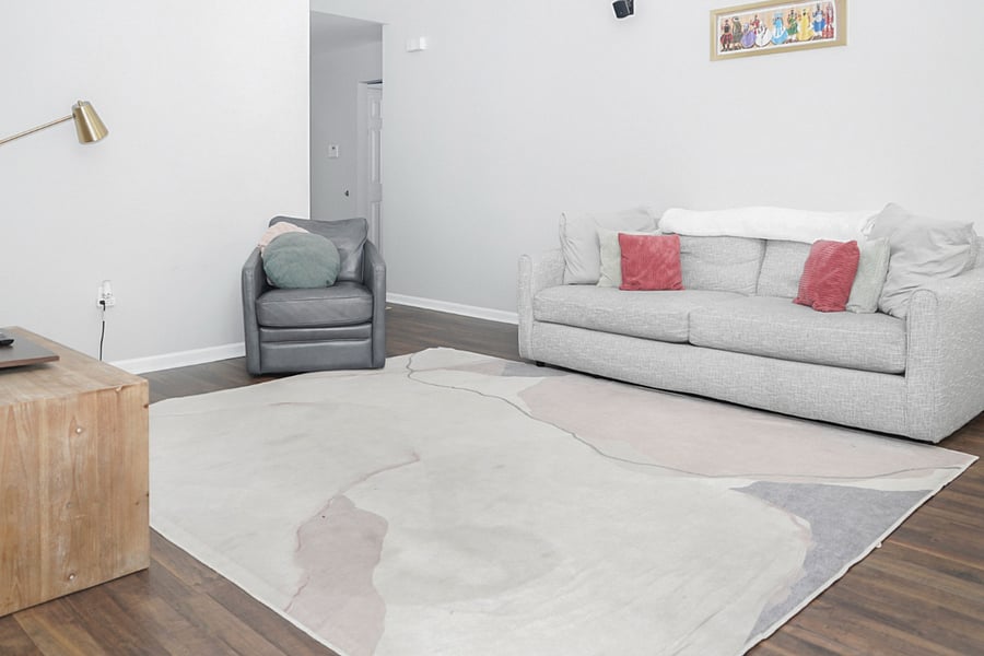 Kick back and relax in the cozy living room, complete with a plush couch, a comfy armchair, and a stylish rug. Its the perfect place to unwind, dive into a good book, or have a meaningful conversation.