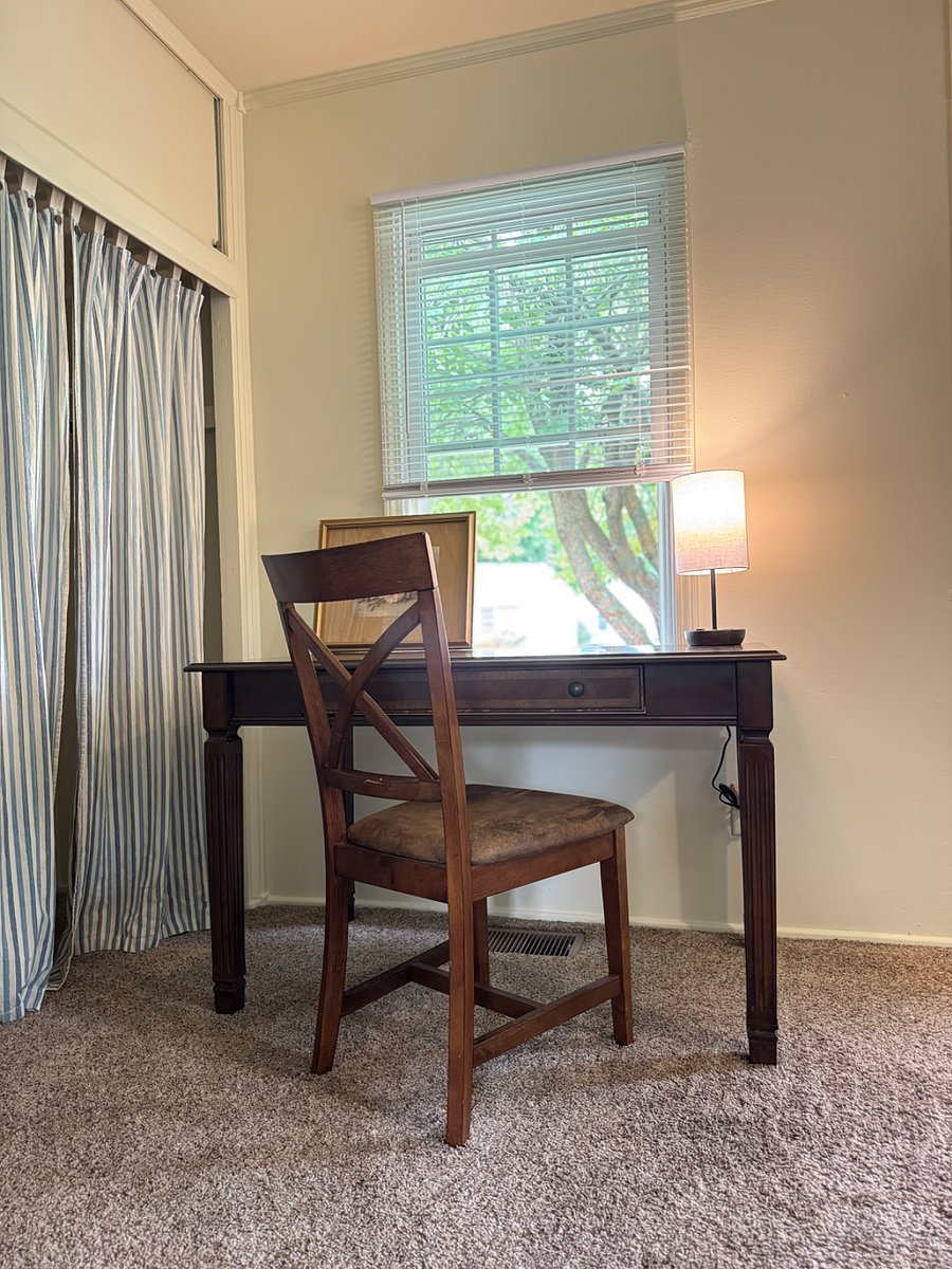 Office space looking out to a mature tree and quiet cul-de-sac