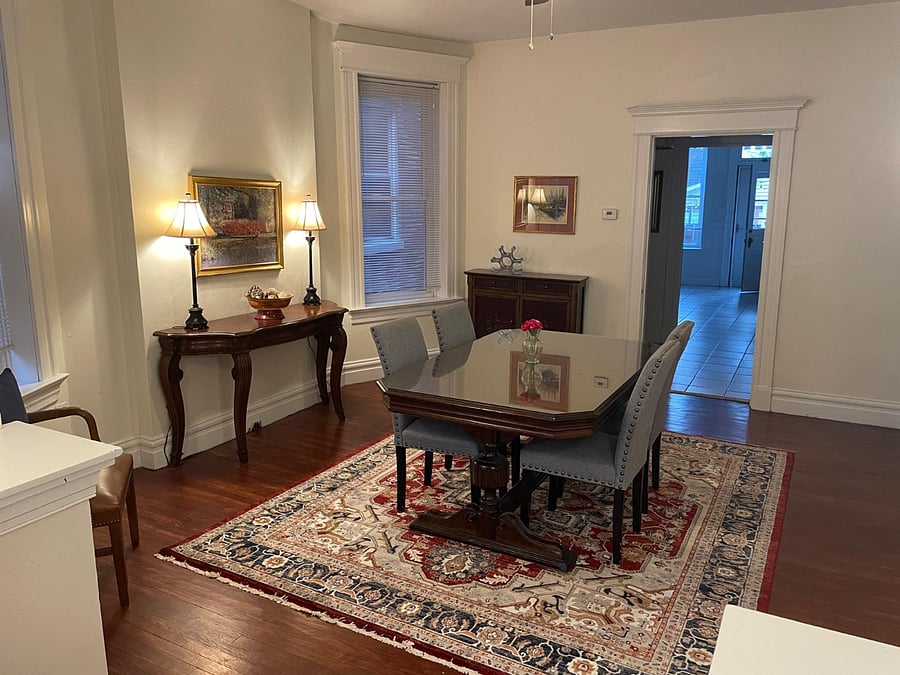 Dining room facing into butler's pantry and kitchen