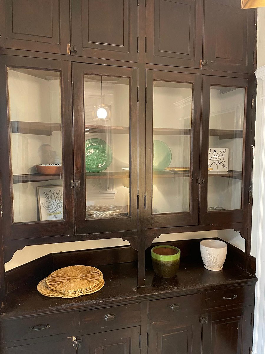 Unique original butler's pantry area connects kitchen to dining room