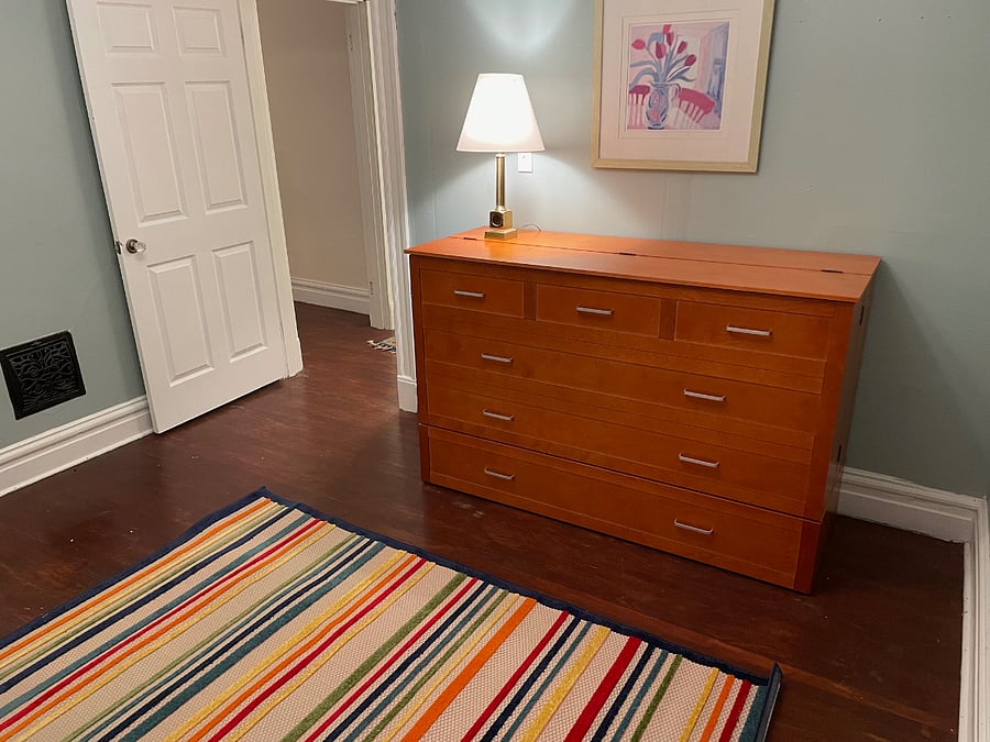 Queen bed folds away easily to look like a dresser - space can be used as an office or 2nd bedroom - your choice
