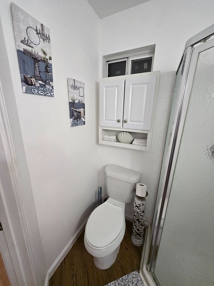 Extra storage space over the toilet.