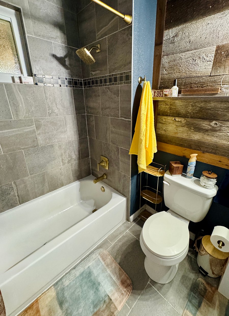 Tub to ceiling tile and privacy glass on window
