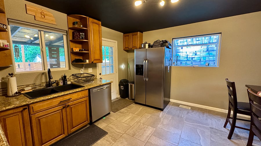 New dishwasher. Trash and recycling included. Back door to covered patio