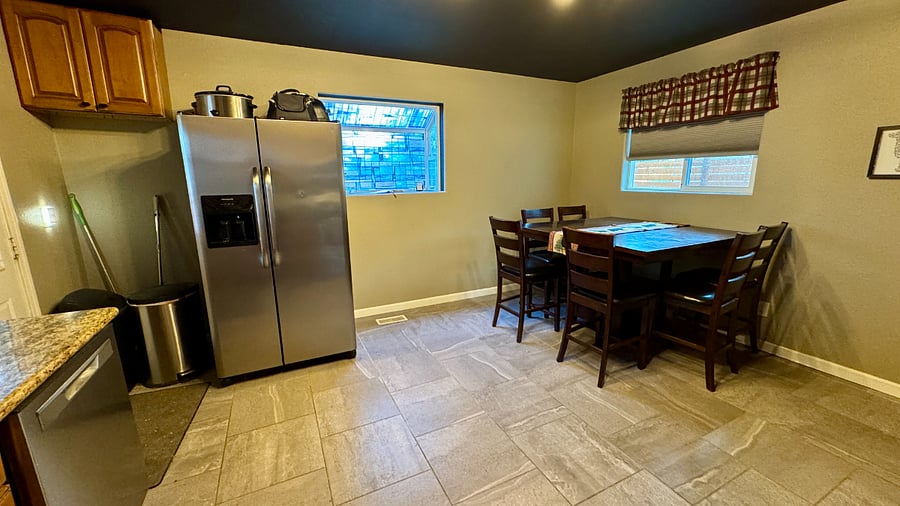 Eat-in kitchen with sibe-by-side fridge