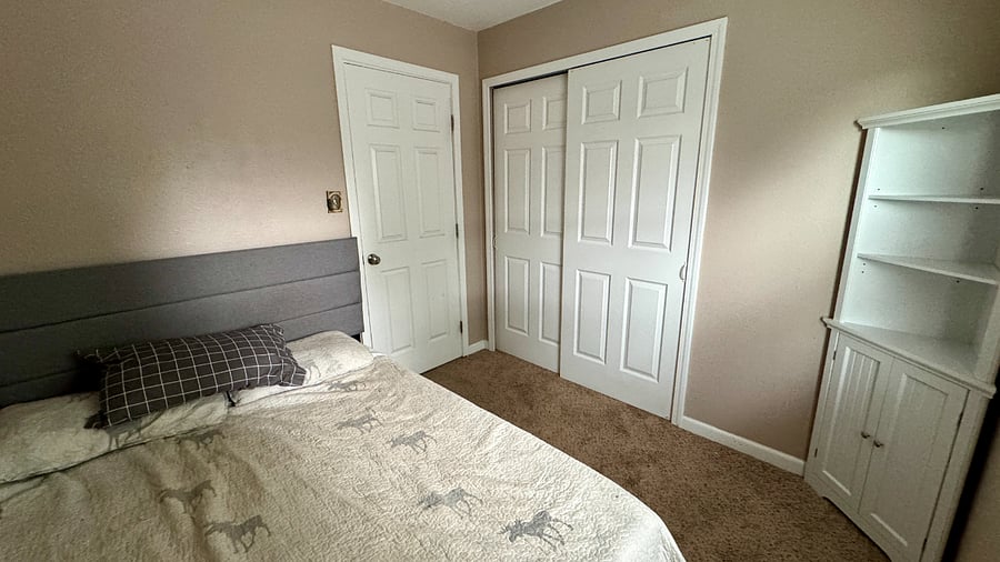 Smaller guest room and closet (fits a full mattress) - could be a good nursery or office too.