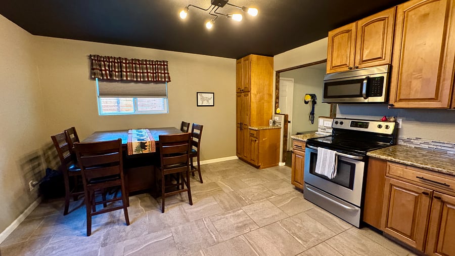 Pantry located in the corner and the counter top has an outlet with usb port.