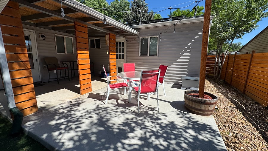 Uncovered patio with dining table and chairs