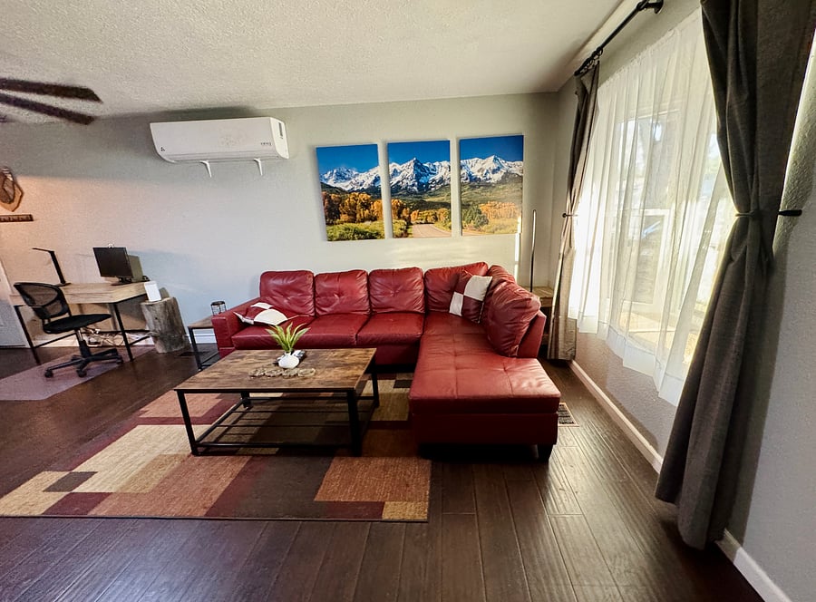Leather couch, mini-split cooling and cool mountain canvas prints