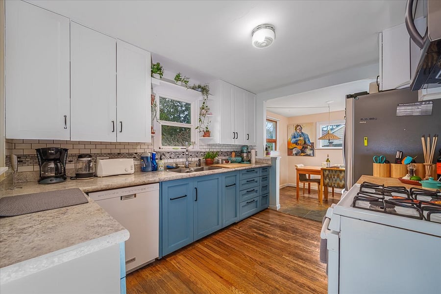 kitchen with pull out cabinets trash and recycle and storage under sink, house has Ridwell subscription.