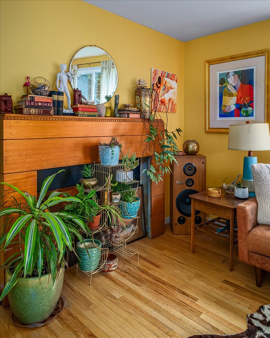this art deco fireplace was salvaged from a historic Seattle mansion, the plants are real, some art may change