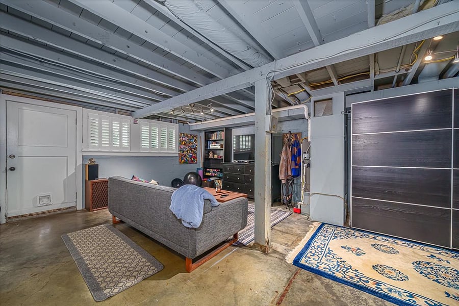basement den, ceiling is high, this room also features large sliding door wardrobe 