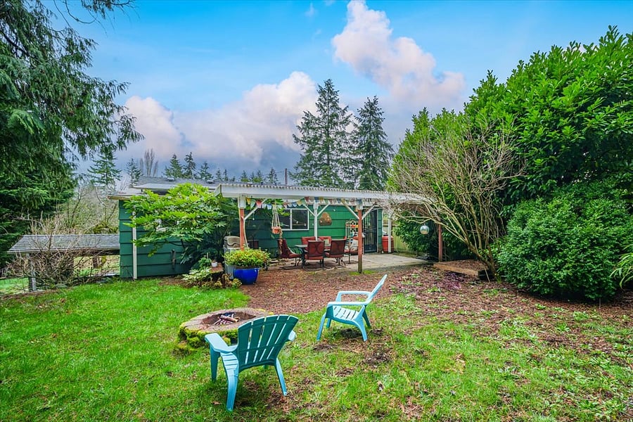 this is the upper backyard, behind the house and super private, it has lights and electric for laptops, potted flowers in summer, firepit, blankets and chairs for entertaining. If you are renting in summer you'll live out here!