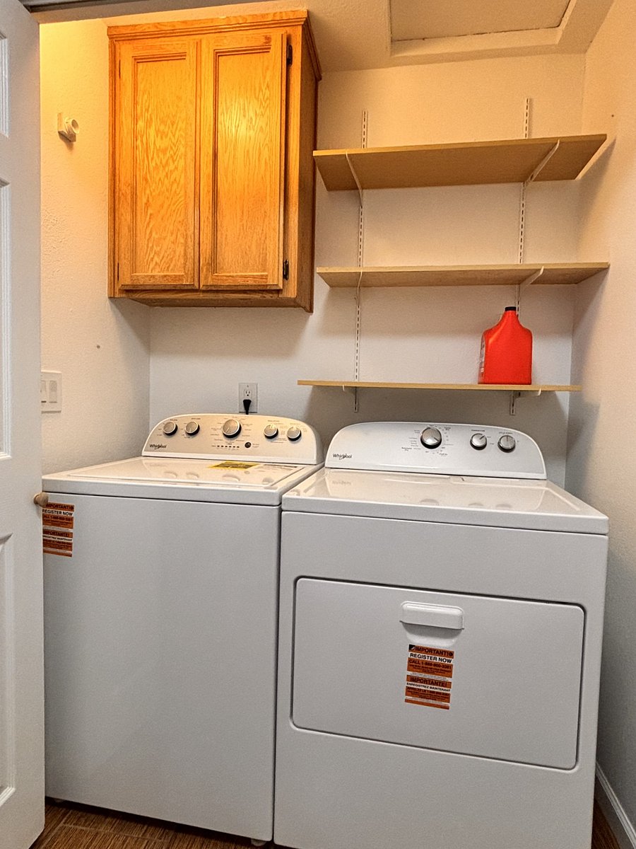 Brand-new washer and dryer at the hallway closet.