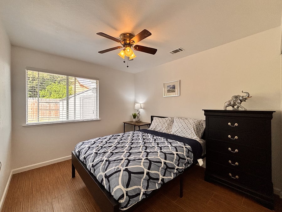 Third bedroom with window look to the backyard