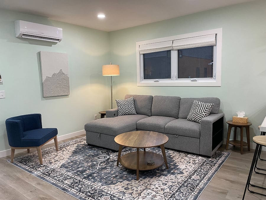 Pull out couch (full size) with USB charge ports on arms.