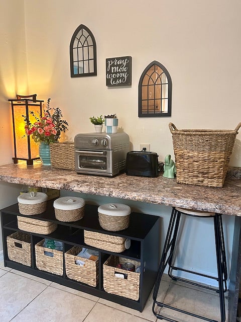 This is the other side of the galley kitchen, complete with tons of storage space, 2 bar stools, charming baskets and an air fryer. (Works great)