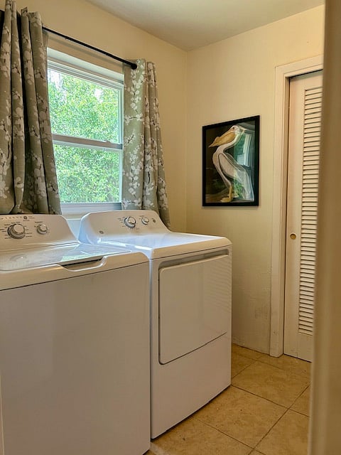 The Laundry room has a lovely window that faces the backyard, and it comes with storage space for your detergent, etc. 