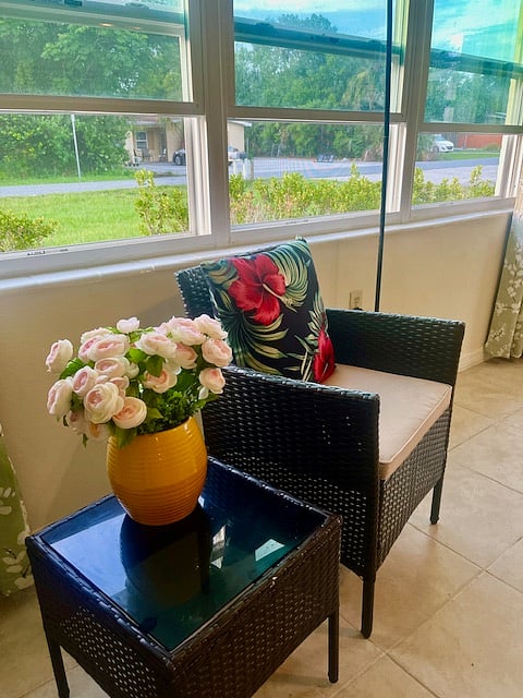 Relax by the big window that brightens up the living room.