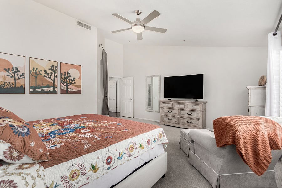 Primary bedroom with king bed and smart TV