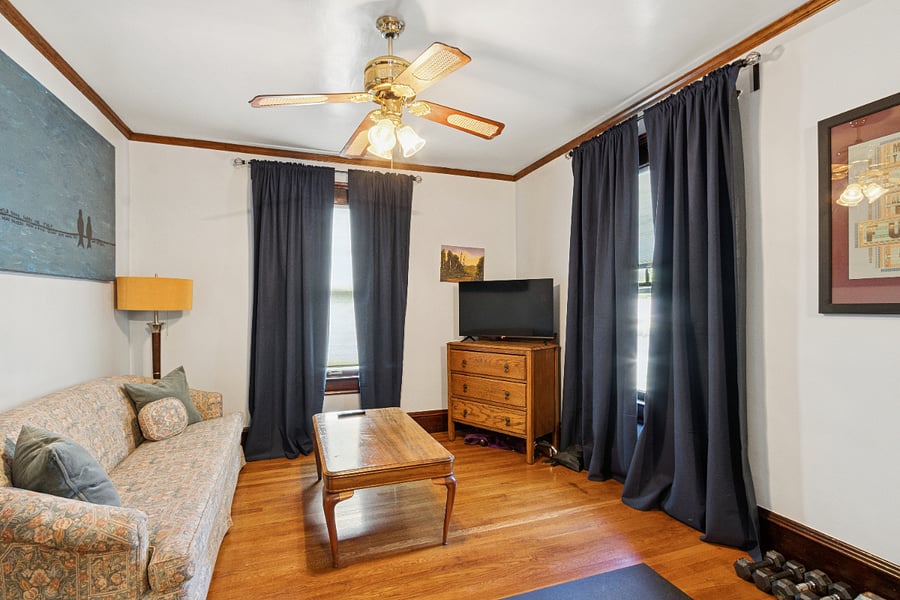 Second Floor: Bedroom 2 with small living room area and tv