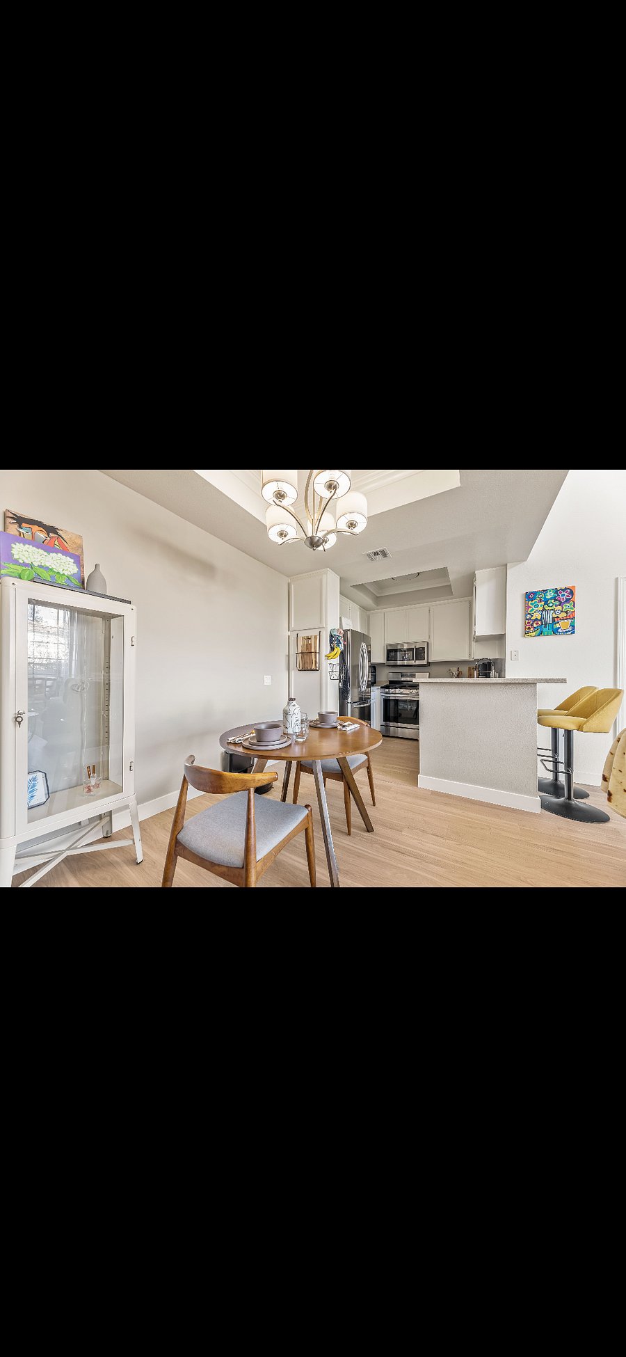 Kitchen with bar seating and dining table