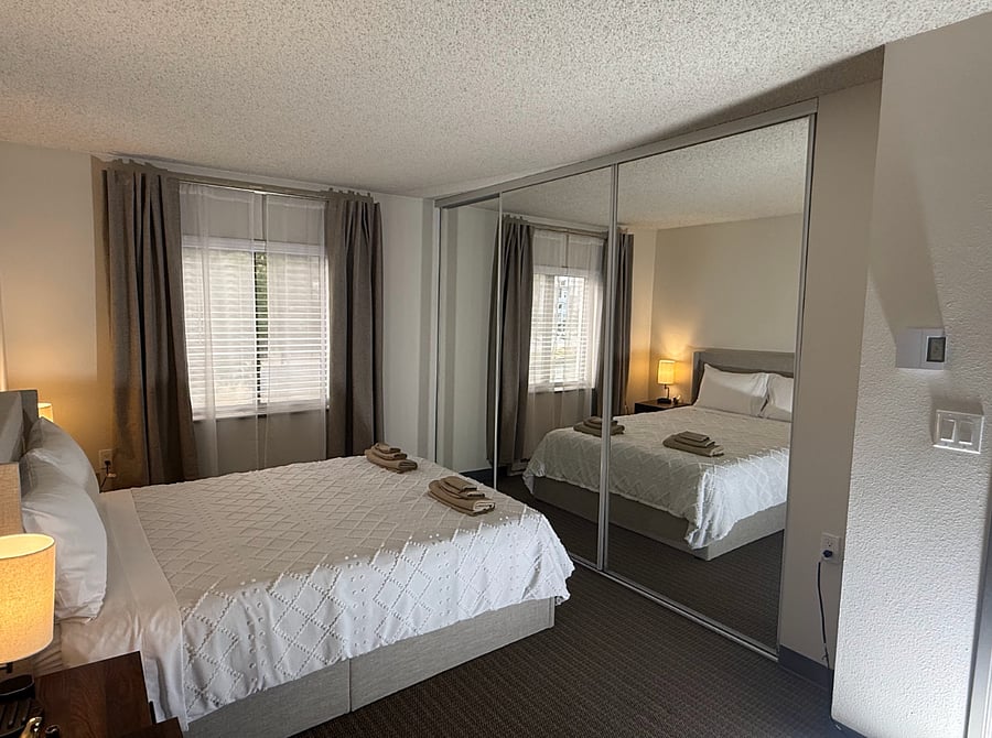Super comfortable mattress and blackout curtains. We have super functional nightstands, with chargers for your phone and computer.