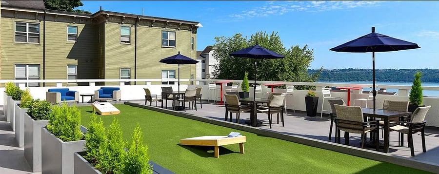 Visit the rooftop lounge! Play, Look, Eat, Drink, Chill. Views of the city and water.