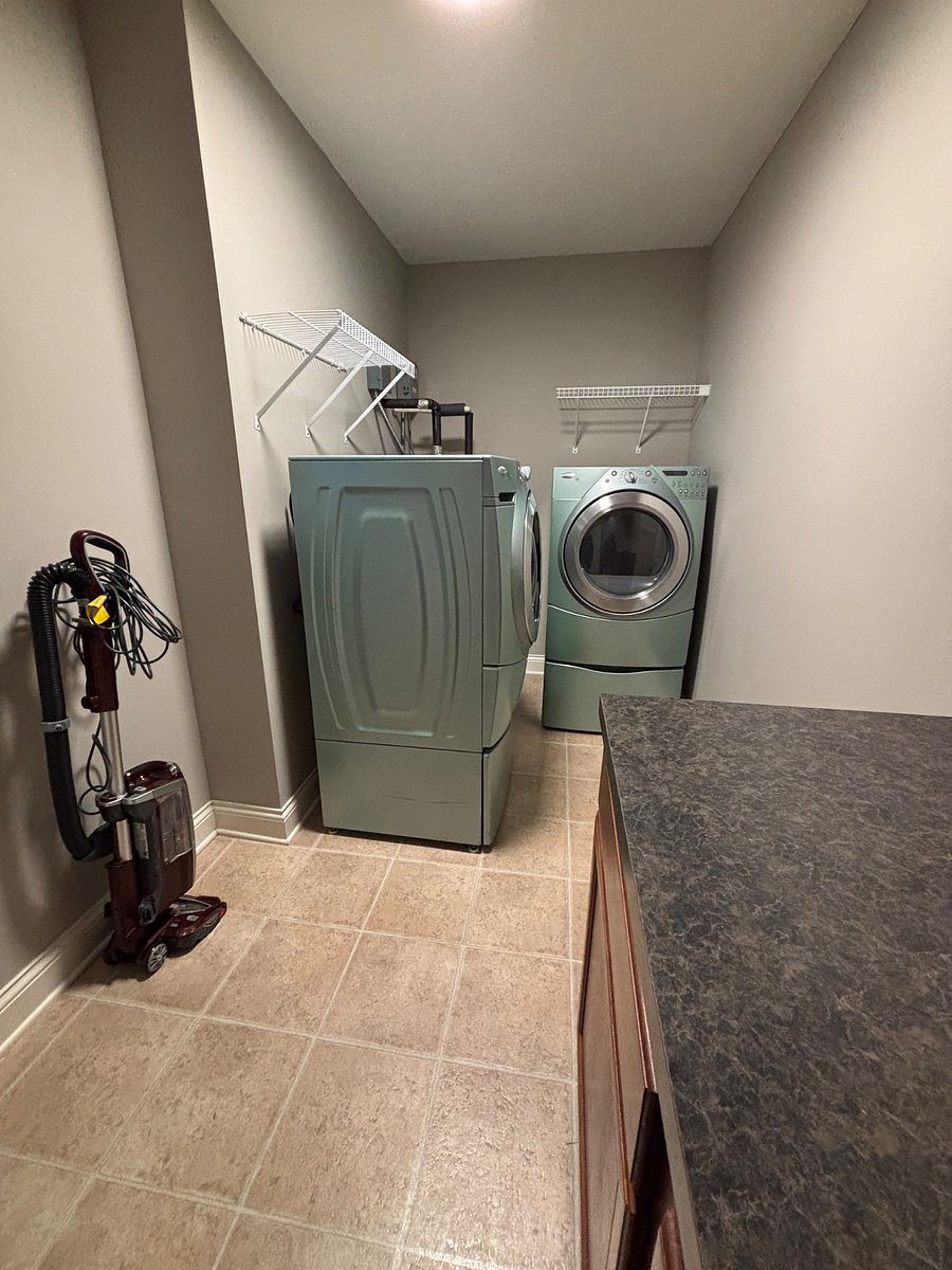 Laundry with vacuum and cleaning supplies
