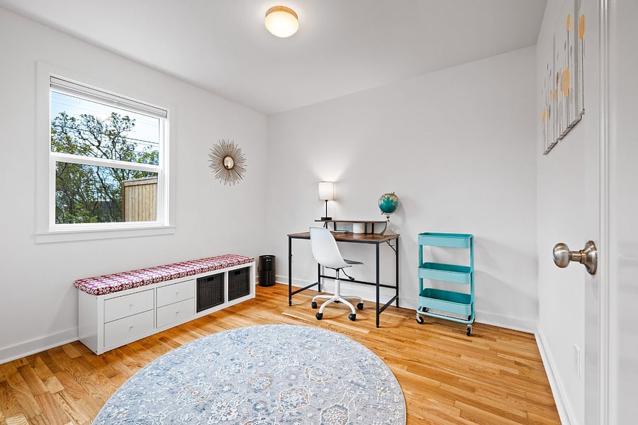 Downstairs bedroom 2. Can be set up with a queen bed or as an office or work out space - whatever best suits your needs.