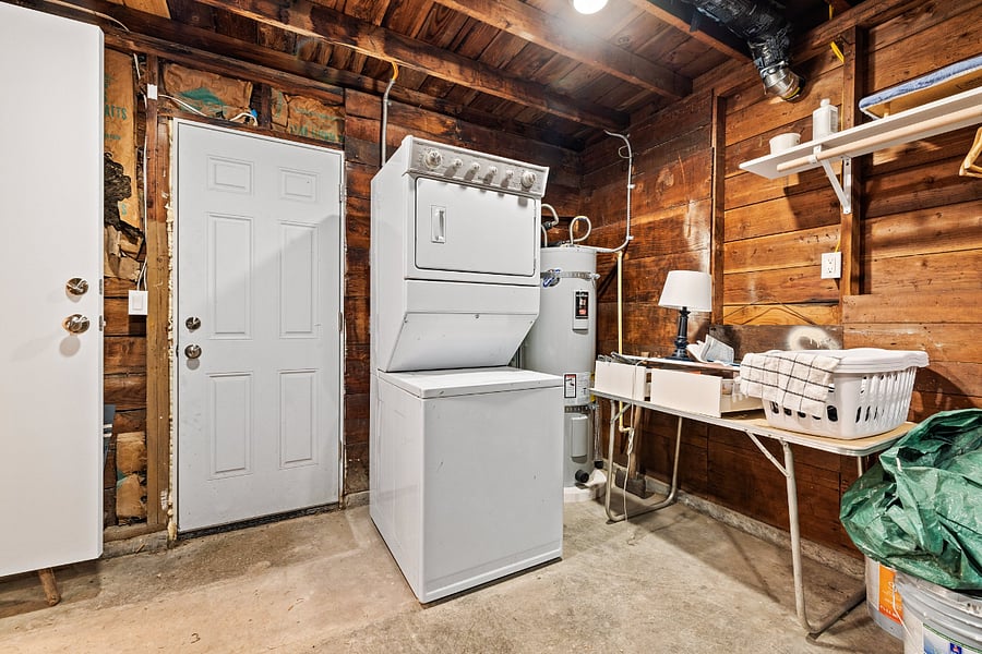 Laundry located off the kitchen in the garage.