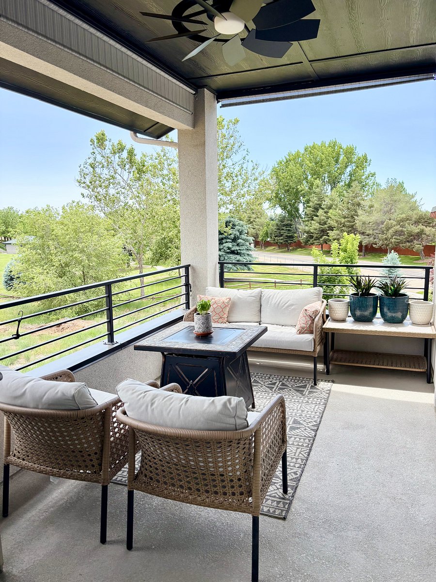 Relaxing balcony with gas firepit and rolldown shades