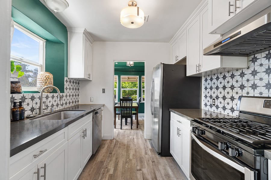 Kitchen with farmhouse sink, Gas Stove, and Large refrigerator. Fully stocked with pots, pans, utensils, instapot....Fyou name it!