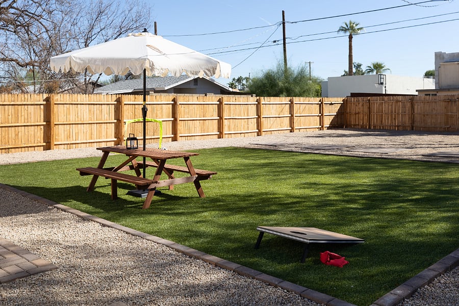 spacious fully-fenced backyard with artificial turf (no mowing required!) and plenty of room to play and run around with any furry friends that might join you during your stay