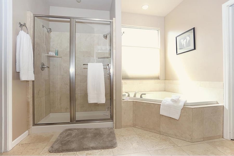 Primary bathroom shower and tub