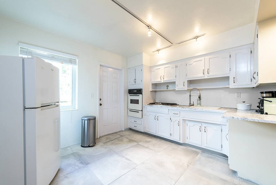 Fully equipped kitchen with brand new Samsung Bespoke white glass panel refrigerator and newly installed glass door (upgraded since photo)