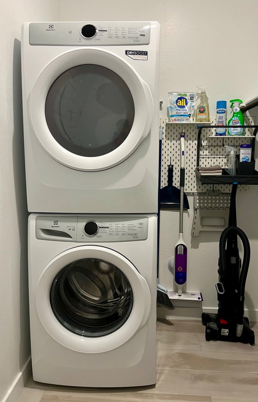 Full-size washer & dryer with starter laundry supplies. Vacuum cleaner, broom, mop, and starter cleaning supplies. 
