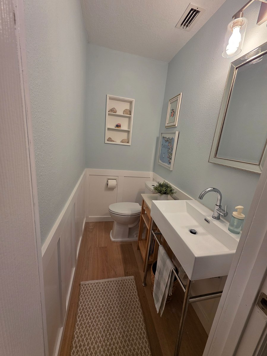 Second bedroom half bathroom,
mirror has medicine cabinet