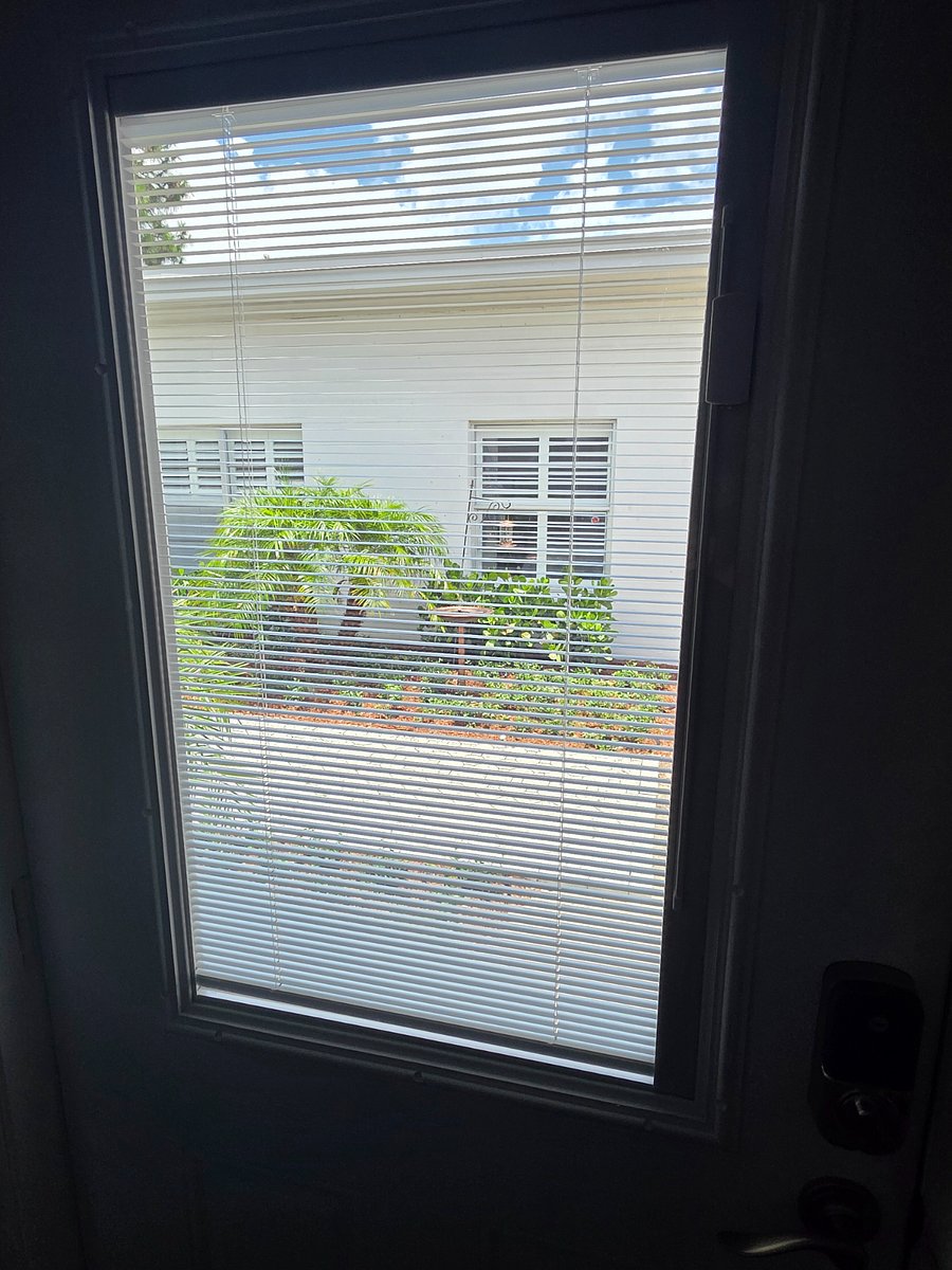 Courtyard door has blinds for extra light and views.