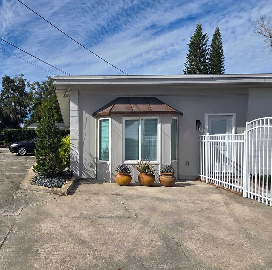 Locked and gated entry to shared courtyard, spacious guest parking to the left has room room enough to park 4 cars, meaning guests have super maneuverability for their vehicles.