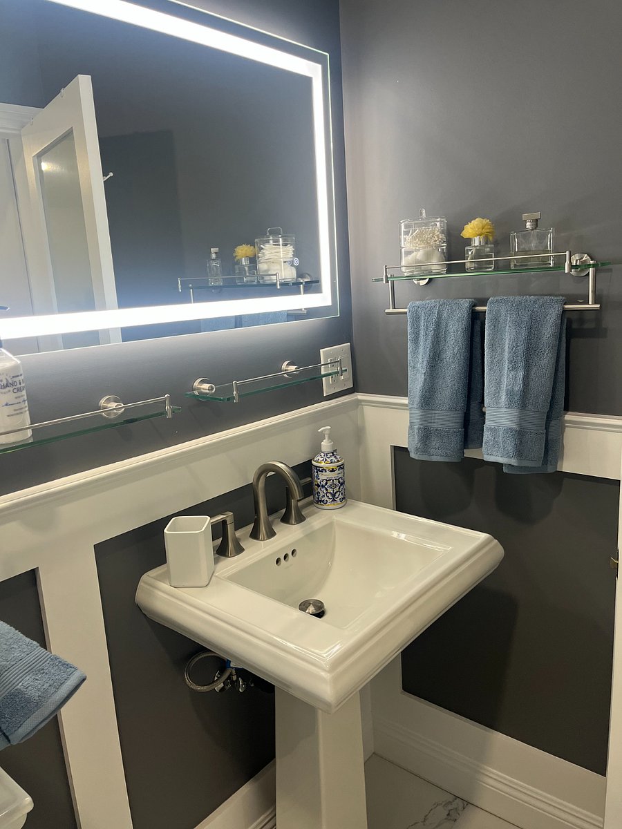 Plenty of floating shelves for personal care products.