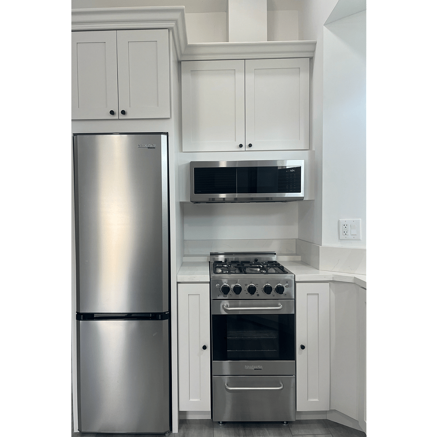 Refrigerator, gas stove/range, over the range vent and microwave.