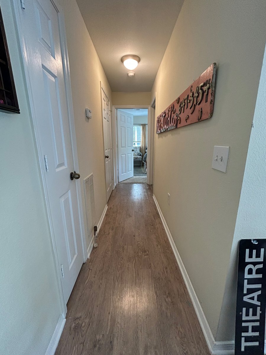 Hallway leading to the bathroom on the left and your bedroom on the right