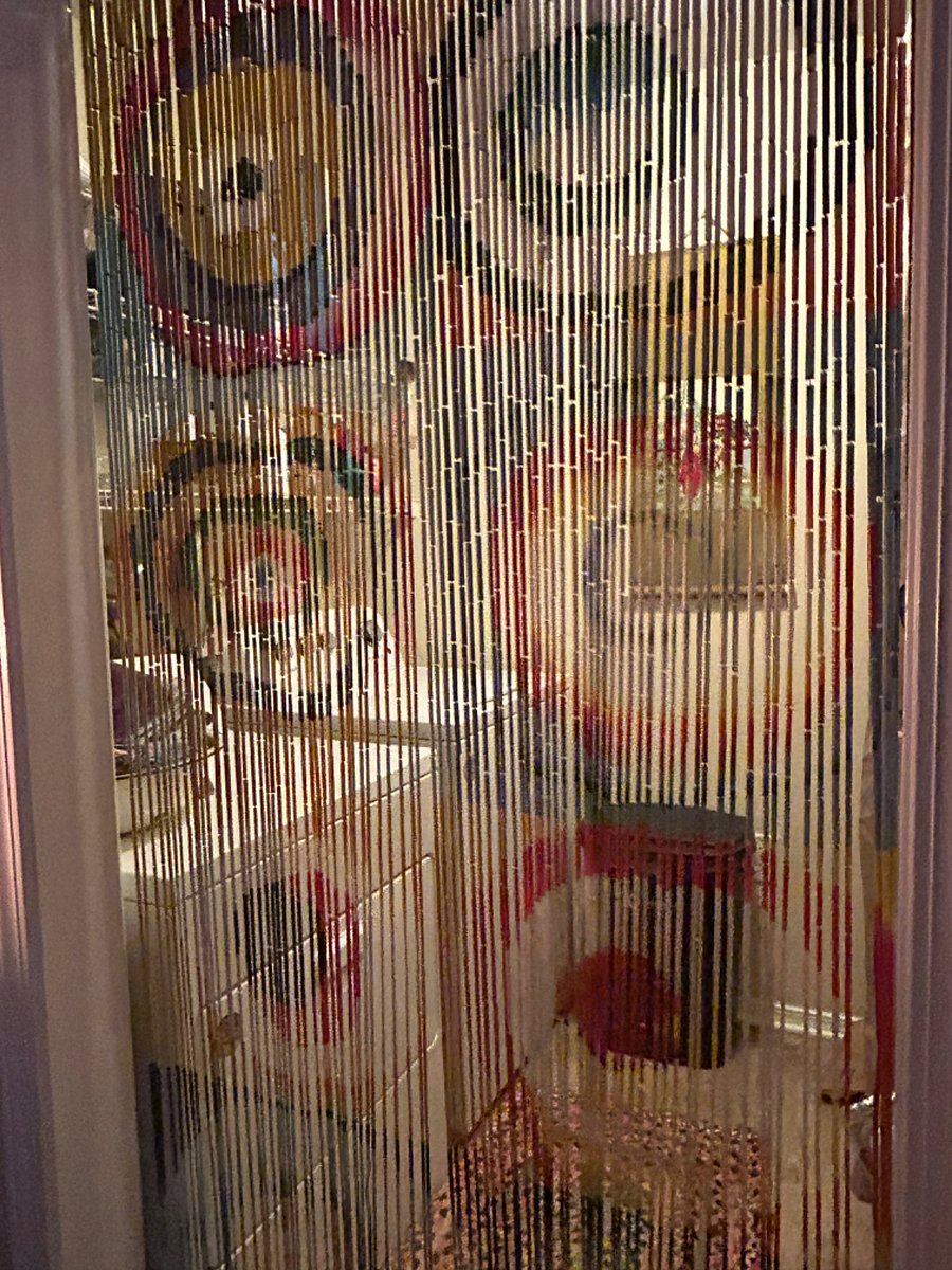 Beaded curtains in the kitchen seperate the laundry area. I supply Melaleuca organic laundry products.