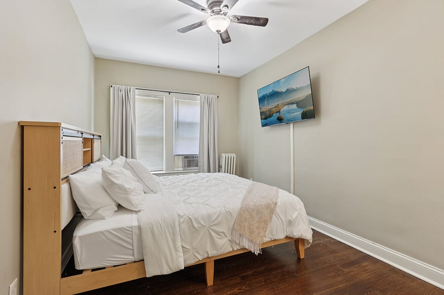 Master bedroom w/ noise machine and black out curtains