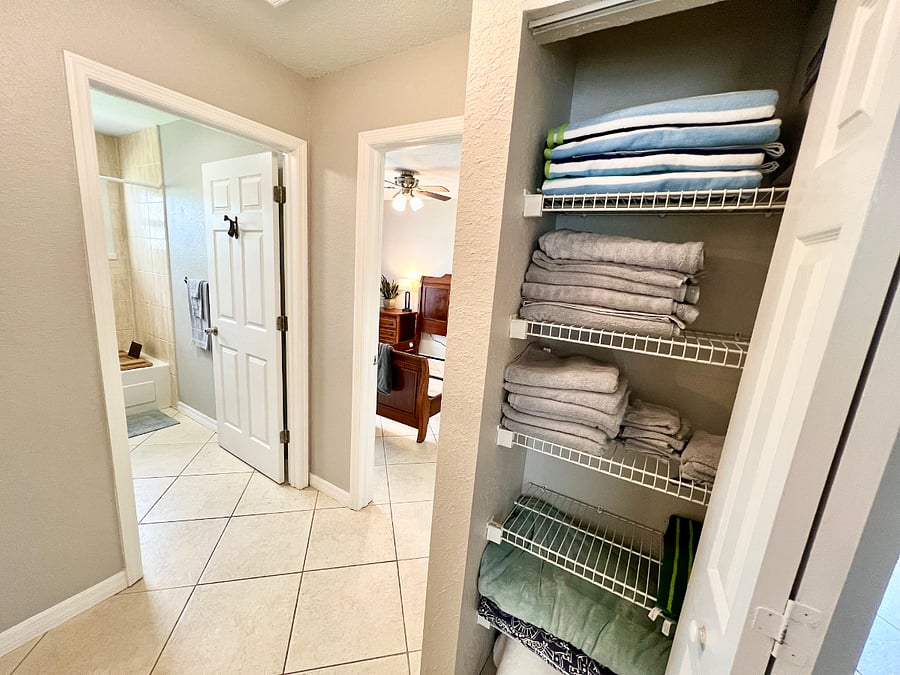 Hallway linen closet fully stocked