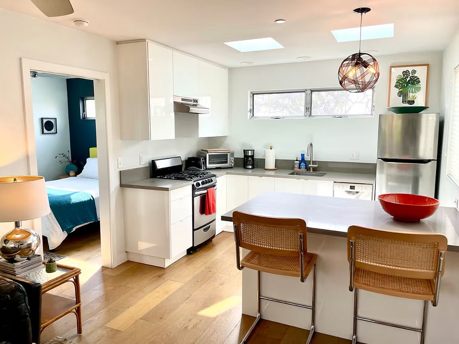 Full kitchen with peninsula dishwasher, countertop convection oven