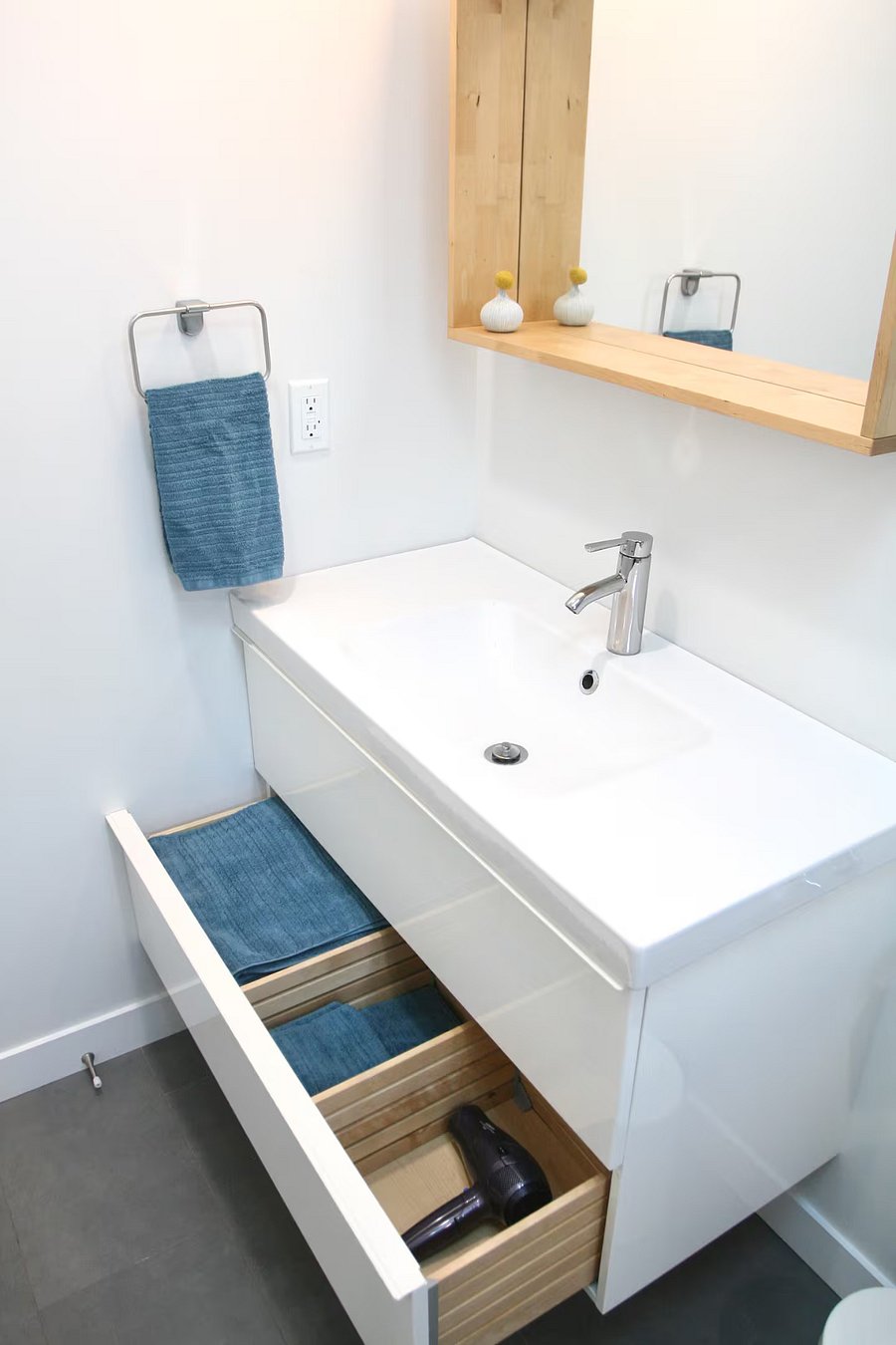 Sink cabinet with drawers for linens and personal items