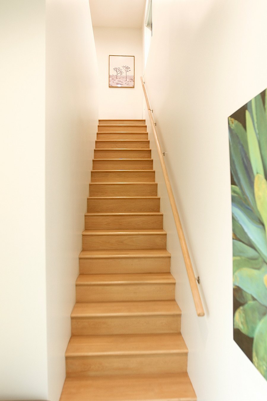 Foyer and stairwell up to apartment